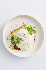 poached egg on the white plate