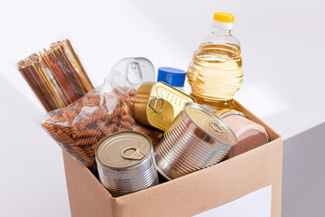 Donation Box of Free Food. Carton Box with Canned Food, Cereals and Grocery. Meal Reserves. Emergency Food Storage in Case of Crisis. Free Social Help, Blessings and Care. Strategic Food Supplies