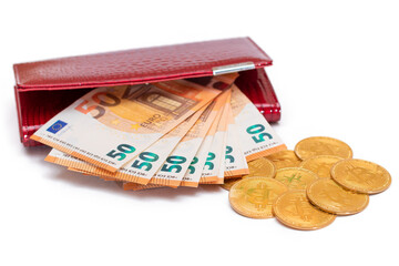 Red Leather Women Purse with Fifty Euro Banknotes and Bitcoin Coins - Isolated on White Background....