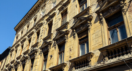 Fototapeta premium Historic architecture detail of a building in Timisoara Romania under clear blue sky