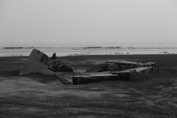 Abandon structure on the beach side with sea background 