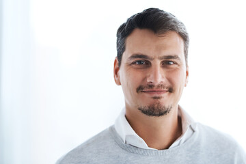 Obraz premium Man, portrait and confident employee in office, confident financial advisor and ready for consulting. Male person, professional and proud of career in workplace, accounting firm and job opportunity