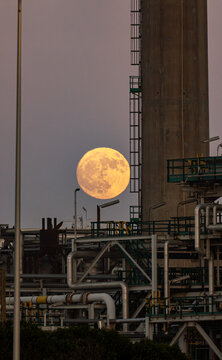 Full Moon Rising Over Industrial Zone in Porto