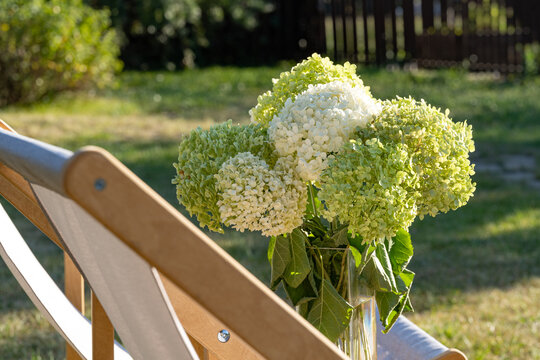 Serene outdoor lounge with hydrangea bouquet