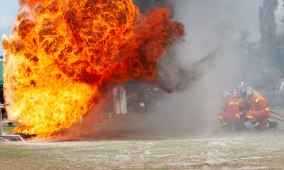 Firefighters demonstrating how to extinguish a fire