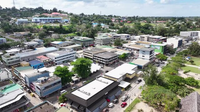 Port Vila, Efate, Vanuatu - Soaring Above the Buildings and Establishments of the Coastal Town, Offering a View of Feiawa Park - Aerial Drone Shot