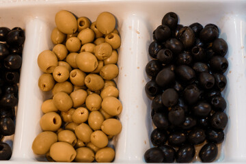 Assorted Olives in a White Tray Perfectly Displayed