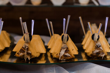 Creative Fruit Presentation of Pineapple Moth Snacks at a Culinary Event