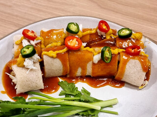 Close-up of Pork & Tofu Fresh Spring Roll on the plate.