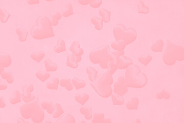 pink hearts on a delicate pink background. Background for a postcard