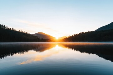 Obraz premium Tranquil sunset reflecting on a serene lake, capturing the essence of calmness in minimal detail.