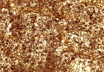 Golden glitter cosmetic body face hair gel serum soft oil texture or eye shadow on white background