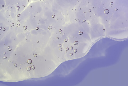 Liquid gel with bubbles cosmetic smudge texture purple lilac lavender background