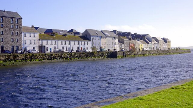 Galway Ireland The long Walk - A picturesque and charming view of a quaint coastal town featuring a row of colorful houses along the water