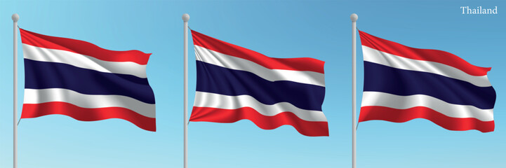 Set of three flags of Thailand waving on flagpoles