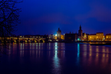Fototapeta premium Night view on old town of Prague with Charles Bridge or Karluv most illuminated