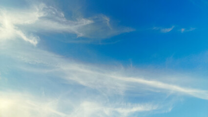 Fototapeta premium The blue sky is decorated with dense clouds that spread out on a sunny day. Sky background. Nature Background.