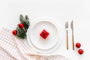 Festive Christmas table setting with red colored decoration. Top view