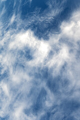 White clouds on blue sky. Soft white clouds against blue sky with copy space.