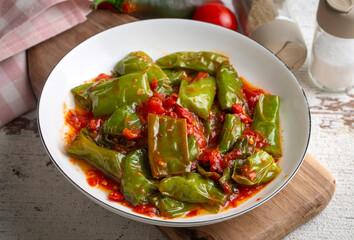 Fried green peppers with tomato sauce - Turkish name; domates soslu kizarmiş biber