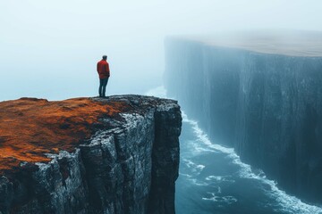 A middle-aged man standing on a cliff edge, looking out over a vast ocean, representing a search for meaning