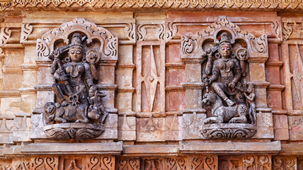 Carved sculpture of Goddess Mahishasurmardini and Goddess Ambe on Shamlaji Vishnu Temple, Aravalli District, Gujarat, India.