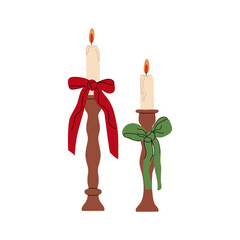 Cozy and hygge decor element concept. Candles with bows. Comfort and coziness. Christmas and New Year.