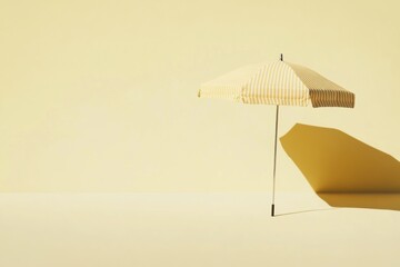 Yellow stripe umbrella in sunny day lighting, light yellow background