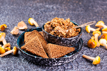 Mushroom pate in a bowl with toast