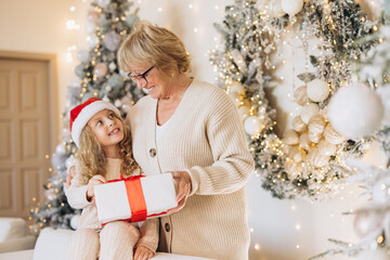 Grandmother and Granddaughter Sharing Christmas Joy and Gifts
