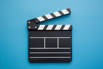 Clapperboard, movie and cinema concept, blue background