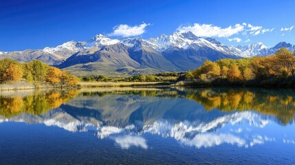 Fototapeta premium Calm mountain lake with crystal-clear water, mirroring the snow-capped peaks and creating a serene, stunning mirror effect