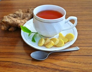cup of ginger tea, with organic ginger and slices