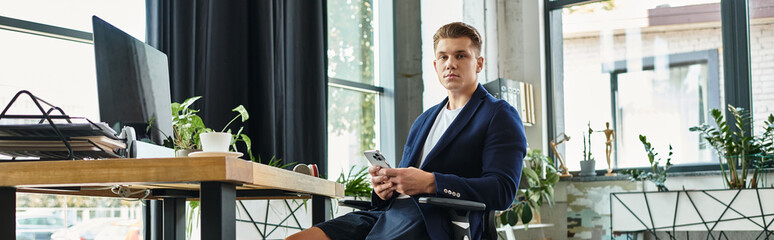 A young businessman working in a contemporary office.