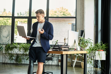 A youthful man with a prosthetic leg engages in work discussions at a stylish office space.