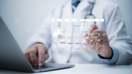 Medical worker with virtual digital calendar on laptop for plan treatment patient and follow up in...
