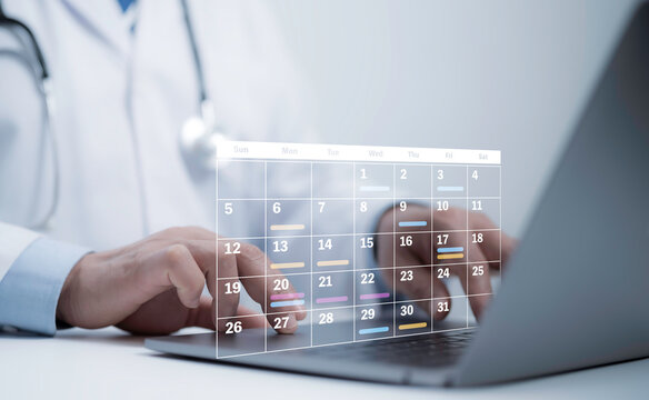 Medical worker with virtual digital calendar on laptop for plan treatment patient and follow up in hospital. Calendar agenda appointment meeting schedule concept.Planning Organizer, Time management