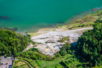 A view from the crater rim towards fumaroles and the lake at Furnas on the island of San Miguel in...