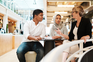 Meeting, planning and workshop with business people in office for support, training or mentor....