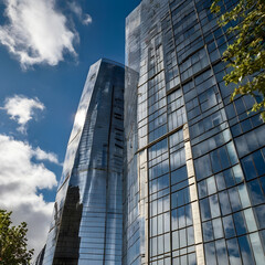 Fototapeta premium Modern architectural design with reflections and greenery