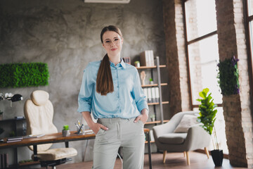 Photo of confident positive lady recruiter dressed shirt eyewear indoors workplace workstation loft