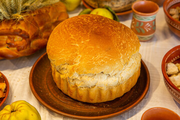 Assortment of baked bread and buns on the table in a bakery. Traditional Romanian bread on the table in Romania.