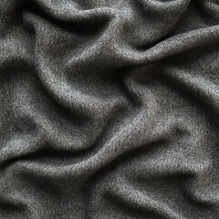 Fototapeta premium Textured gray fabric cloth displaying natural folds and creases.