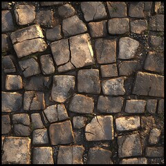 Close-up of ancient cobblestone pavement, showcasing irregular stones and earthy textures.