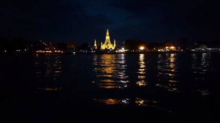 Fototapeta premium Night View of Temple Reflected on Water Surface