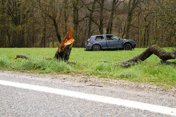 Abandoned car standing by the road after the traffic accident. Completely destroyed and wrecked.  
