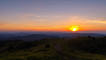 Sunsets in the hill background.