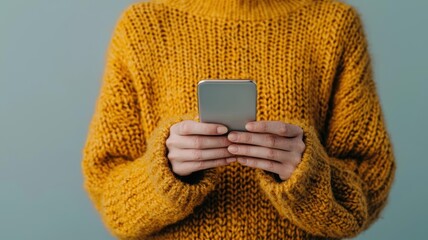 Hands of a young adult completing an online purchase with a phone, digital interface, mobile shopping ease