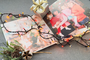 a Photobook of family. Photobook is gift. photo album next to gifts