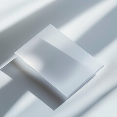 A translucent business card with frosted glass effect, minimalistic typography in white and light grey
